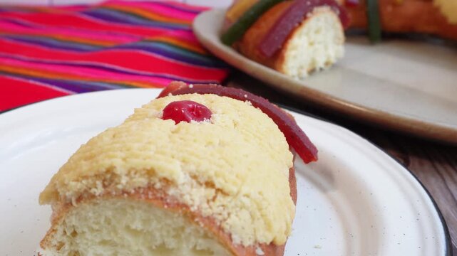 Visual tour of a table with a slice of "Rosca de reyes" to celebrate January 6, Three Kings Day in Mexico