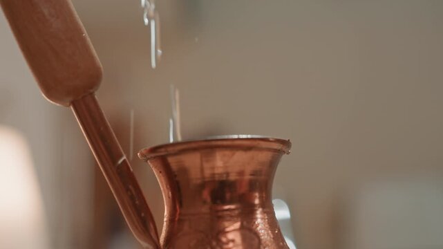 Dynamic water splash into copper cezve, kinetic droplets and bright glints, macro closeup capturing rhythm and tempo, playful brewer moment with beatlike motion and lively musical energy