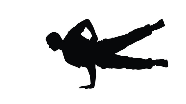 Silhouette of Male Breakdancer Performing One Hand Freeze Trick