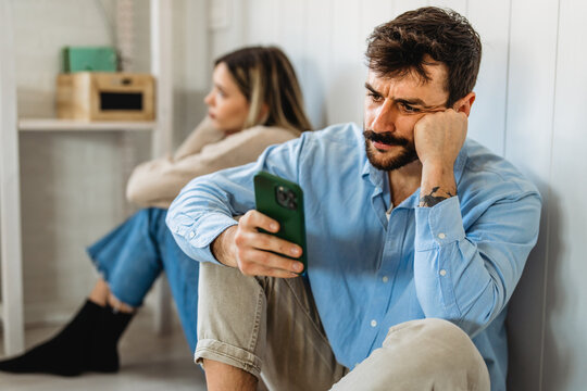 Gadget addiction and relationship problems. Couple with smartphones ignoring each other