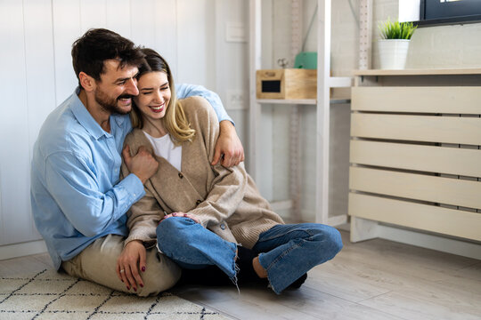 Happy couple smiling warmly, showing emotional balance and trust in a positive relationship