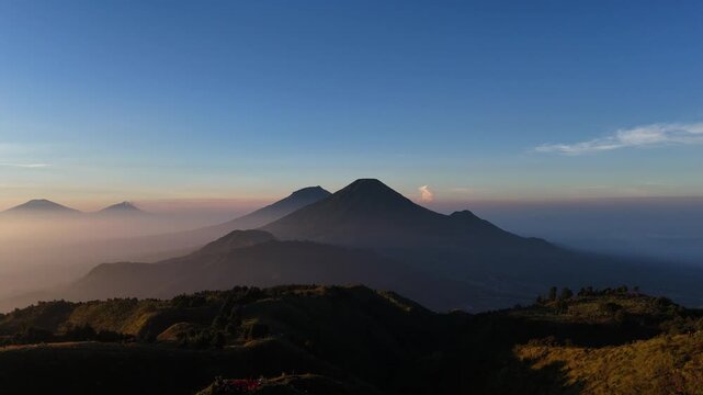 Aerial footage of Mount Sumbing and Sindoro from the top of Mount Prau.