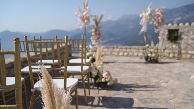 Captivating wedding held outdoors amid majestic mountain landscapes and blooms