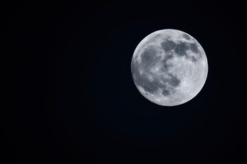 Fototapeta premium full moon on black isolated background, copy space