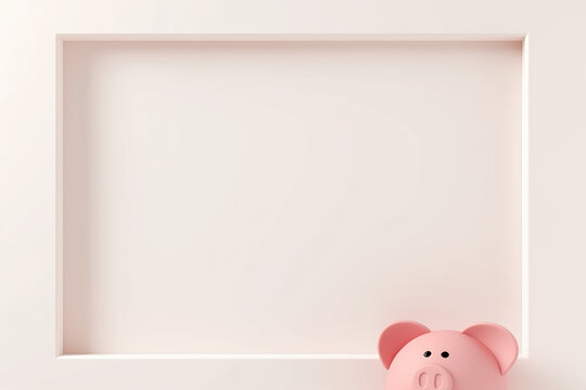 Pink piggy bank beside empty frame with copy space