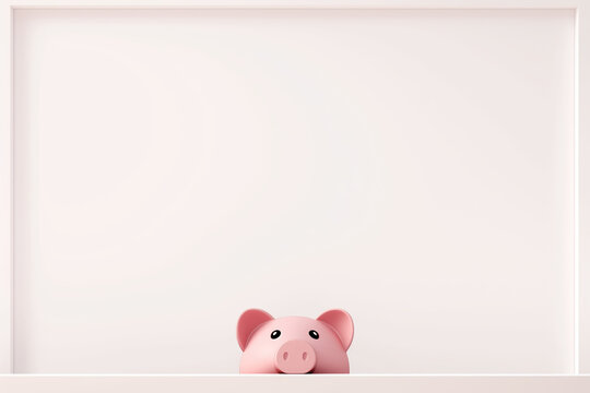 Funny piggy bank peeking over wall