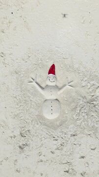 Christmas Sand Snowman Art on Tropical Island Beach Aerial View