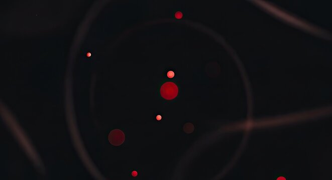 Abstract representation of an atom with orbiting electrons on a dark background.