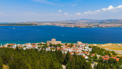 Naklejka premium Kilitbahir, Turkey. Canakkale. Kilitbahir Fortress overlooking Dardanelles strait with city of Canakkale visible across the water on clear sunny day. Aerial View
