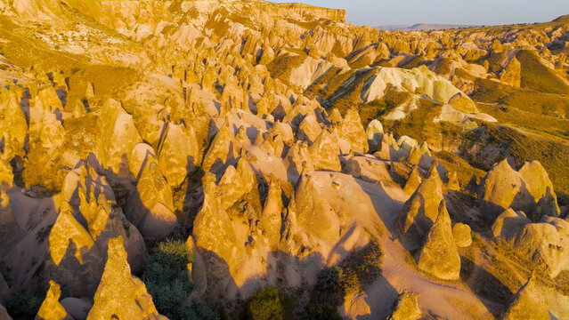 Goreme, Nevsehir, Turkey. Sunset aerial view of Devrent Imagination Valley with vibrant colored rock formations and surreal landscapes in Cappadocia.. Aerial View