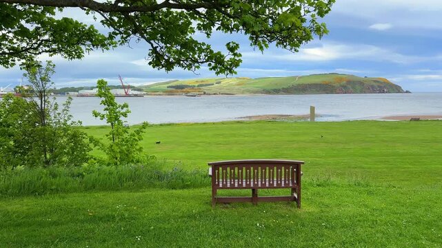 Wooden Bench with Panoramic View of a Coastal Landscape