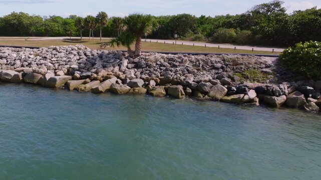 Aerial view of rocky shoreline at Sebastian Inlet, ProRes 422HQ footage