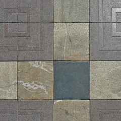 Fototapeta premium Stone pavement made of different slabs with geometric structure in a pedestrian area in Palma de Mallorca. Top view detail with natural texture and urban character.