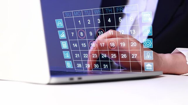 Person is using a laptop to plan activities and manage calendar events from a workspace in the afternoon.