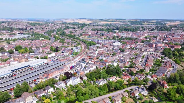 Aerial tracking shot of Salisbury city centre and train station