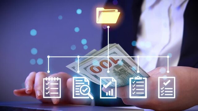 Business planning process with cash and documents on table in office environment during working hours.