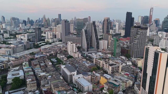 Aerial view of Bangkok financial district skyline and mixed urban development