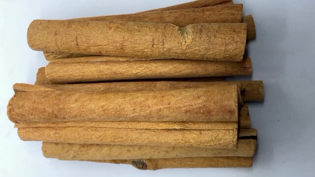 Row of aromatic dried cinnamon bark sticks spice dalchini 