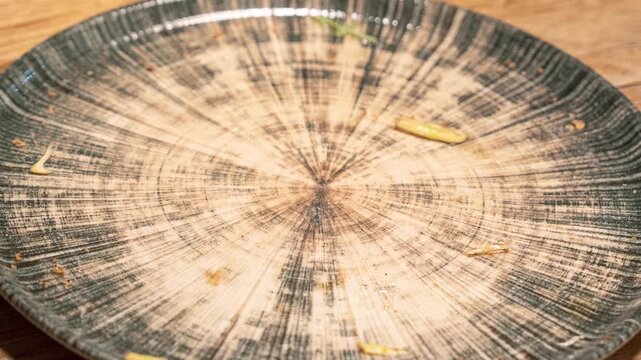 Step-by-step view of artichoke pizza as slices are removed from full plate to empty