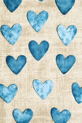 Obraz premium Blue heart pattern on textured burlap background