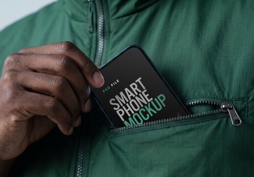 Smartphone Mockup Being Pulled From Zipper Vest Pocket By Hand