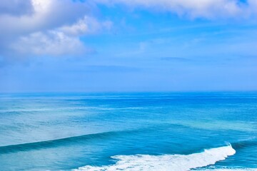      Bali, Indonesia - June 7, 2022: The Uluwatu Temple on a Cliff. Perched dramatically on a steep cliff, Uluwatu Temple stands at an elevation of 97 meters above sea level, offering breathtaking oce © Scotts Travel Photos