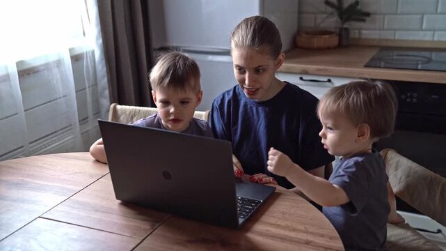 Mother guides boys in technology. Family bond through technological curiosity and warmth. Maternal figure fostering technological interest among boys under gentle warm kitchen illumination