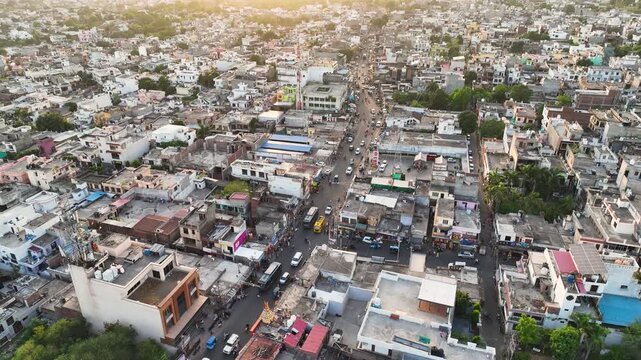Smooth Orbiting View of Dense South Asian Town and Main Road Traffic