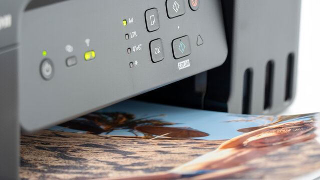 Modern printer outputs vibrant photographic prints