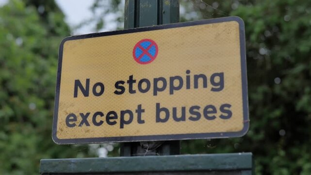 Cutaway shot. No stopping except buses road sign. 
