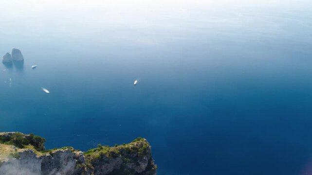 Spectacular panoramic drone footage of Capri from Monte Solaro under blue sky