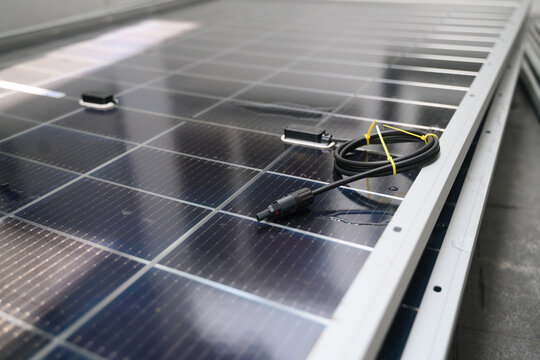 Solar Cell Installation Home Rooftop &ndash; Close Up of Photovoltaic Panel with MC4 Connector Cable