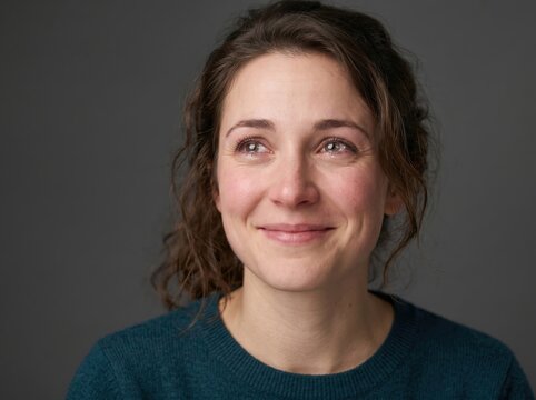 A woman with a genuine expression of admiration, sparkling eyes and an emotional reaction, high-quality, sharp and detailed photo, isolated background.