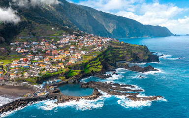 Naklejka premium Aerial view of Madeira island. Land meets ocean in Seixal, Madeira, Portugal