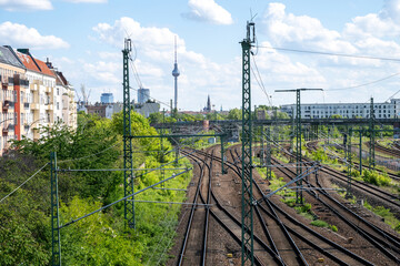 Railway tracks leading towards Berlin skyline with TV Tower in Germany © Inga