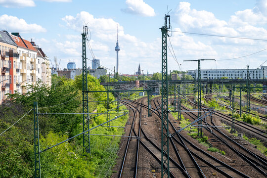 Railway tracks leading towards Berlin skyline with TV Tower in Germany