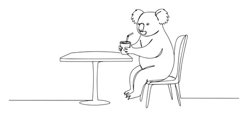 koala sitting at table with drink © Wieslaw