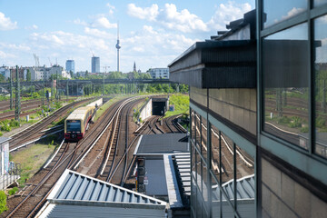 Naklejka premium Railway tracks leading towards Berlin skyline with TV Tower in Germany 14