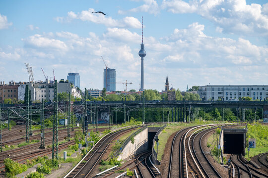 Railway tracks leading towards Berlin skyline with TV Tower in Germany 13