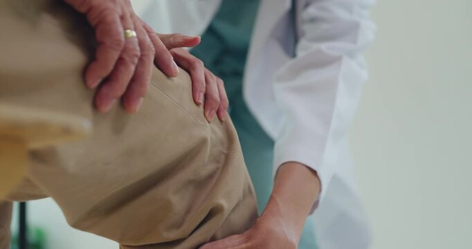 Closeup Asian female doctor examining senior man injured knee at hospital clinic. Physical therapy treatment, joint arthritis pain recovery, osteoarthritis medical care, physician consult concept.