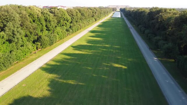 Spectacular aerial scenery of Caserta Palace and surrounding park with green symmetry