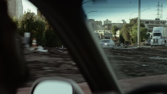 Man driving a car on a sunny day in Los Angeles, California