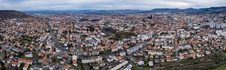 Obraz premium Aerial panorama view beside the old town around the city Clermont-Ferrand in France on a cloudy spring day.