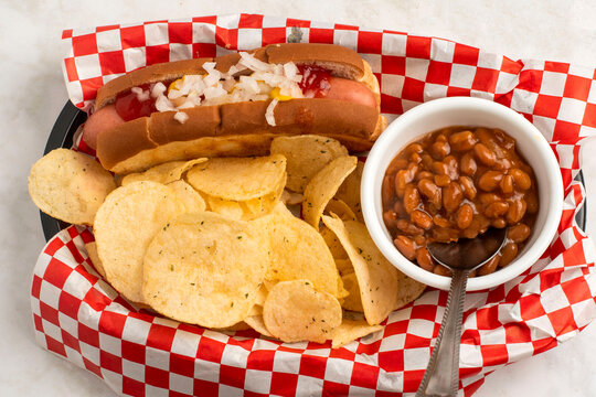 hot dog  with  potatoe  chips and baked beans