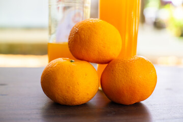 Fresh mandarin oranges stacked on top, showcasing natural, vitamin-rich freshness with vibrant colors and a healthy appeal. © Khoirul