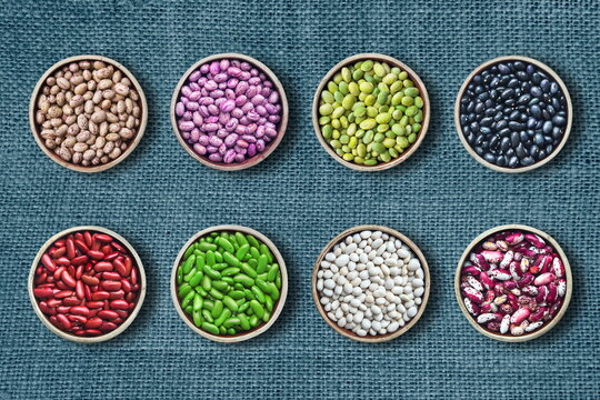 different varieties of beans on textile background