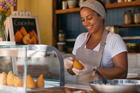Golden-brown Coxinha, a popular Brazilian shredded chicken and cream cheese fried dough snack, perfect for parties and street food.