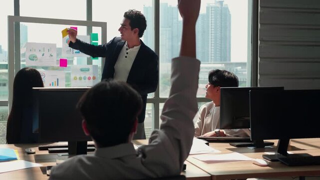 Employee raising hand asking question presentation in office, manager holding tablet listening to team member, corporate workspace with glass board chart, teamwork strategy planning and brainstorming.