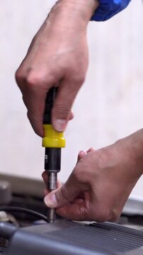 car mechanic hands and screwdriver tools working on automobile performance. Mechanic  man motor technician, repair service and maintenance vehicle machine inspection