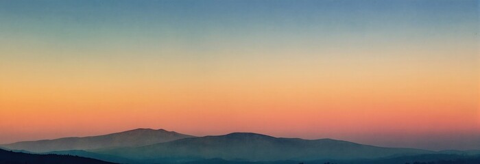Fototapeta premium Soft gradient sky painted with warm sunrise colors over distant mountain ranges. Peaceful natural landscape in watercolor style. Calm atmosphere for relaxation and serenity.